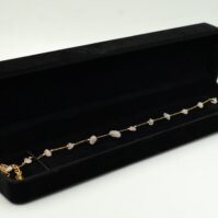 A beautiful Rose Quartz Anklet from Seamoss Africa, used for emotional healing and self-love
