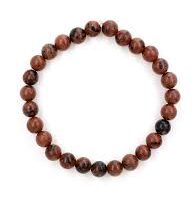 A polished piece of Red Obsidian from Seamoss Africa, used for protection, luck, and grounding.