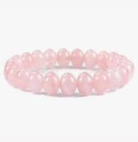 A polished Rose Quartz crystal from Seamoss Africa, used for unconditional love and emotional healing.