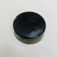 A bar of traditional Cow Dung Soap from Seamoss Africa, used for spiritual cleansing and aura purification.