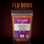 A bottle of pure Flu Bomb Tumeric Ginger Honeybush from Seamoss Africa, used for seasonal wellness, natural immune fortification, and physical revitalization.