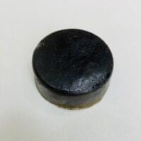 A bar of traditional Cow Dung Soap from Seamoss Africa, used for spiritual cleansing and aura purification.