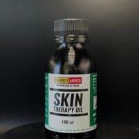premium bottle of Skin Therapy Oil 100ml from Seamoss Africa, a natural blend for hydration and herbal skin support.